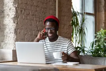 Author on a consultation call while reviewing notes